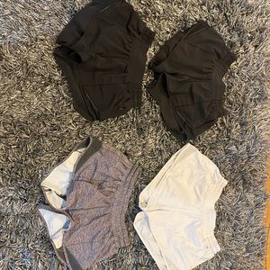 4 pack of Black grey white 2.5 inch low rise Lululemon hotty hot shorts size 2